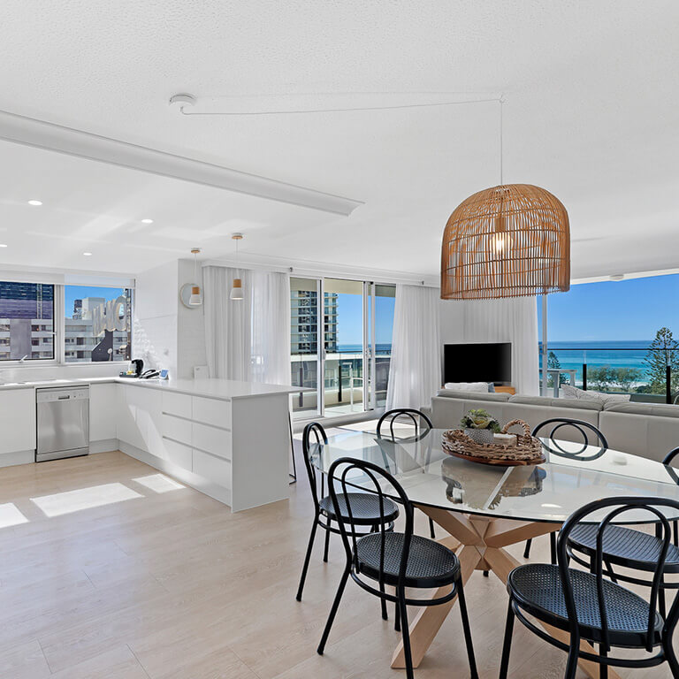 Premium 2 Bedroom Ocean View Apartment at ULTIQA Beach Haven on Broadbeach with open-plan kitchen, dining, and living area.